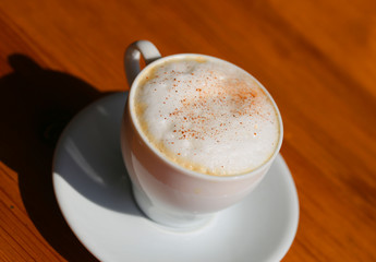 Photo of a delicious bright сup of coffee