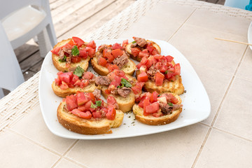 Appetizer of bruschetta with tuna