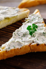 Fried bread on the grill with a crispy crust with garlic sauce, seasoned with herbs