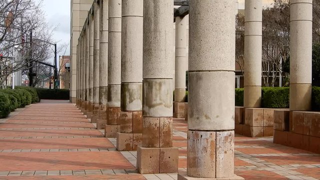 Left To Right Pan Of Pillars At Dennys Headquarters Building Revealing Dennys Fast Food Restaurant Sign