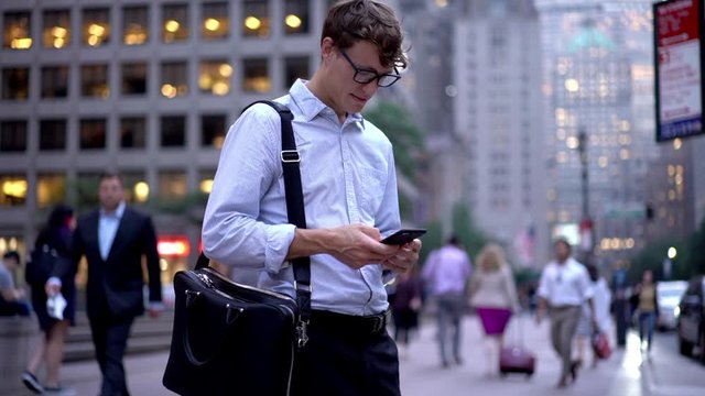 Slow motion effect of intelligent entrepreneur in classic glasses enjoying mobility lifestyle checking information from public website, zoom in on Caucasian man connecting to 4g for browsing