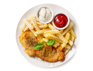 plate of chicken schnitzel and french fries on white background