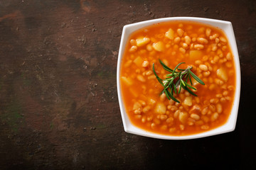 bowl of bean soup with rosemary