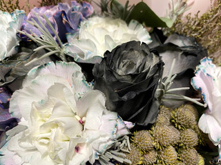 beautiful bouquet of flowers with black molly carnations and black roses