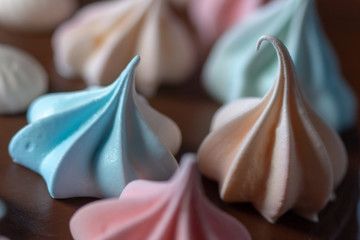 colored meringues on top of the cake