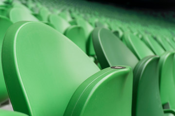 Empty plastic seats in a stadium. Matches to be played without fans.