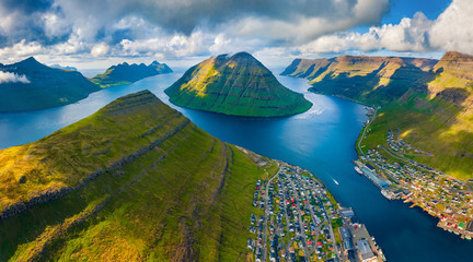 View from flying drone. Awesome summer cityscape of Klaksvik town. Breathtaking morning scene of...