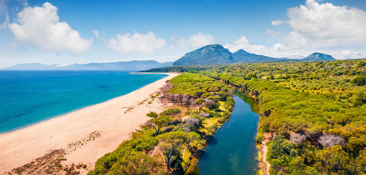 View from flying drone. Picturesque morning view of Osala Beach. Sunny summr scene of Sardinia island, Italy, Europe. Beautiful seascape of Mediterranean sea. Traveling concept background.