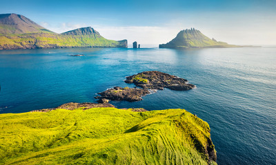 View from flying drone. Breathtaking summer scene of Faroe Islands and Tindholmur cliffs on...