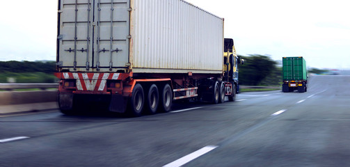 White and green container truck on highway ,transportation concept.,import,export logistic...