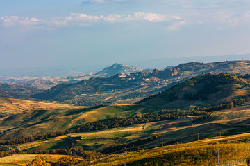 Fototapeta premium Green yellow autumn hills. Breathtaking landscape of Sicily. Travel postcard.