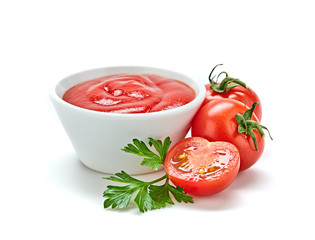 Fresh, organic tomato puree, isolated on white. Tomato cherry sauce in bowl, cooking concept. Healthy vitamin vegetables, vegan diet food condiment. Raw tasty cherry ketchup.