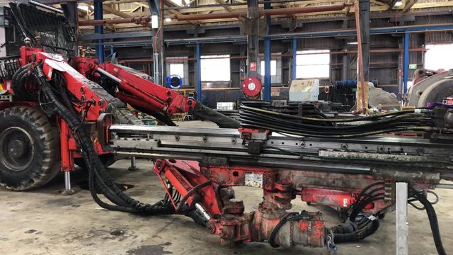 Underground drilling rig being repaired