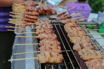 Grilled pork in skewers in the market.