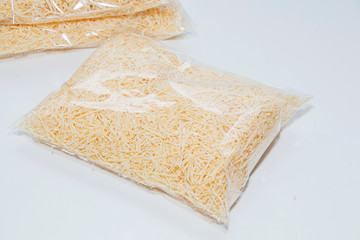 wood shavings in a bag on a light background, filler