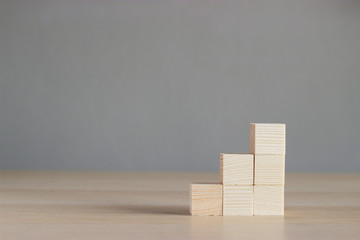 wood blocks on wood table with gray background