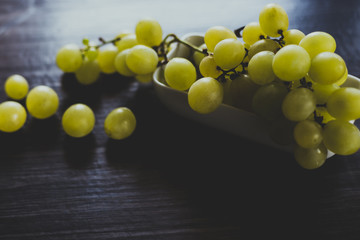 White grapes on wooden table