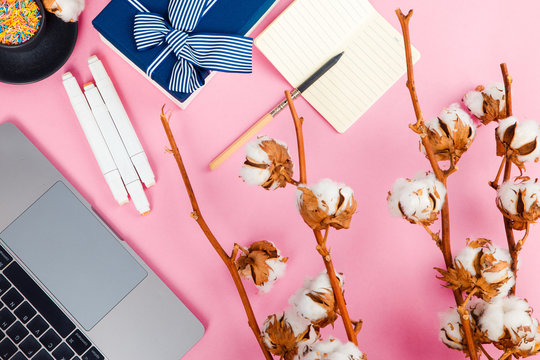 Work computer on a pink background top view. Flat lay. Minimal concept.