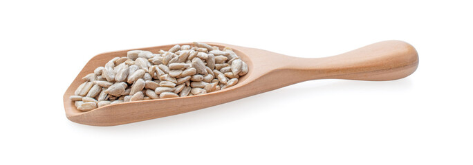 sunflower seeds in wooden spoon on white background.