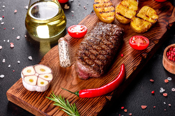 Ribeye steak with potatoes, onions and cherry tomatoes