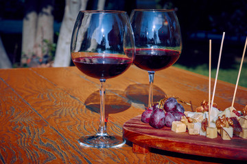 Glasses Of Fine Red Wine With Grape and Cheese