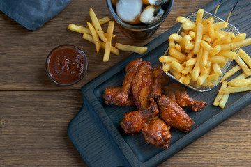 barbecue wings with French fries and Cola