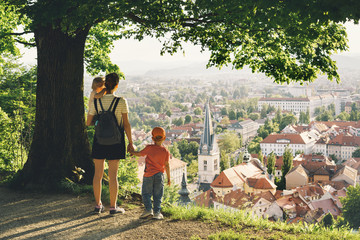 Family outdoors on background of Ljubljana, Slovenia, Europe.