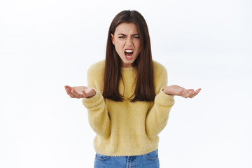 Whats wrong with you. Woman having argument screaming at person with angry outraged and frustrated...