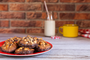 chocolate chip and hazelnut cookies on brik background