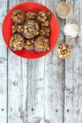 hazelnut and chocolate chip cookies on red plate