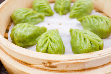 Fresh steamed green vegetable dumplings