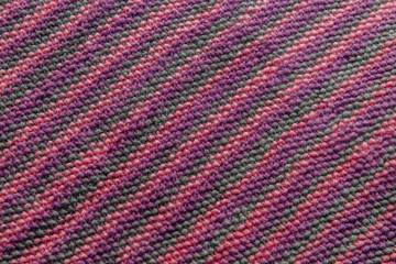 Colored wool knitted fabric with texture. Handwork.
