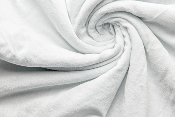 Snow-white velvet background or veluree flannel texture made of cotton or wool with soft fluffy velvet atlas cloth. Curly twisted fabric background.