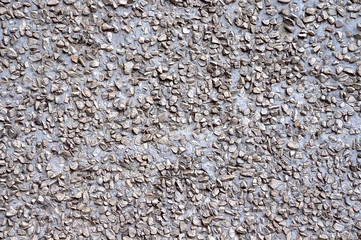 Background cement wall with small crushed stone