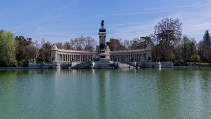 Fototapeta na wymiar Panoramic view of the pond of the Retiro Park, in Madrid, capital of Spain, where there are no boats or people