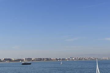 The blue sea beach boat sun Bright sky