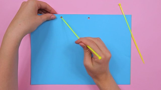 Cable tie life hack with paper, top view