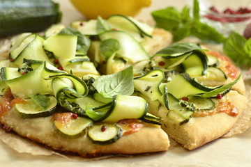 Vegetarian pizza with zucchini, mozzarella and basil