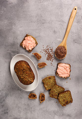 Healthy food. Sliced bread with caviar, figs, nuts and flax seeds on a light grey background. Background image, copy space