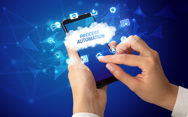 Female hand holding smartphone with PROCESS AUTOMATION inscription, cloud technology concept