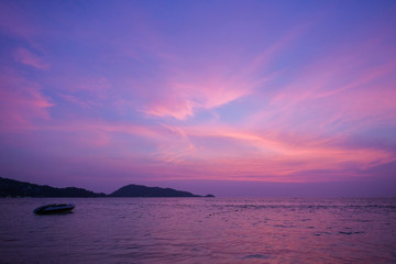 Naklejka na ściany i meble Ocean shore in purple sunset. Twilight.