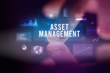 Finger touching tablet with charts and ASSET MANAGEMENT inscription, business concept