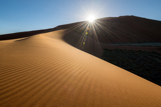 This sand dune was photographed at sunset in the Sossusvlei National Park in Namibia.