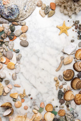 Seashells, starfish and sea pebbles frame, vertical composition of sea stones and seashells, marine composition, composition of seashells, starfish, jellyfish, vertical frame of sea shells, stones