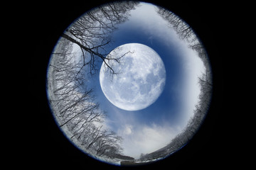 Moon through telescope. Fantastic winter landscape