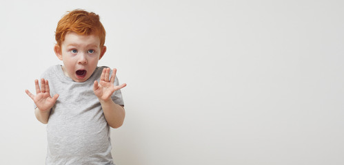 Young boy is afraid to get sick from the corona virus covid-19 / 2019-nCov and is holding his hand...