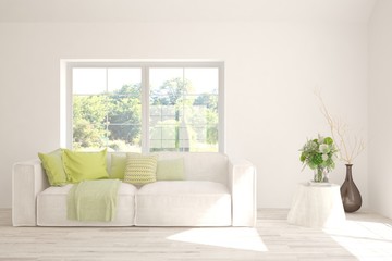 Minimalist living room in white color with sofa and summer landscape in window. Scandinavian interior design. 3D illustration