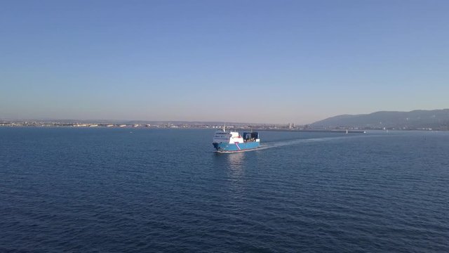 Aerial view of a medium vessel cruising at sea.