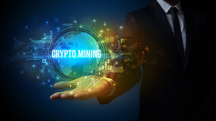 Elegant hand holding CRYPTO MINING inscription, digital technology concept