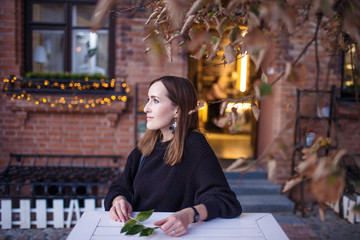 girl at a street cafe in the old city, portrait, look, street look